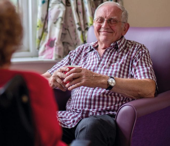 A service user at one of our Older People services smiles